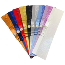 Load image into Gallery viewer, A fan-like arrangement of colorful ribbons with decorative embellishments, such as rhinestones or crystals, displayed against a white background.